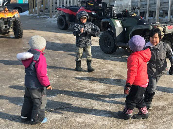 Bundled up in snowsuits